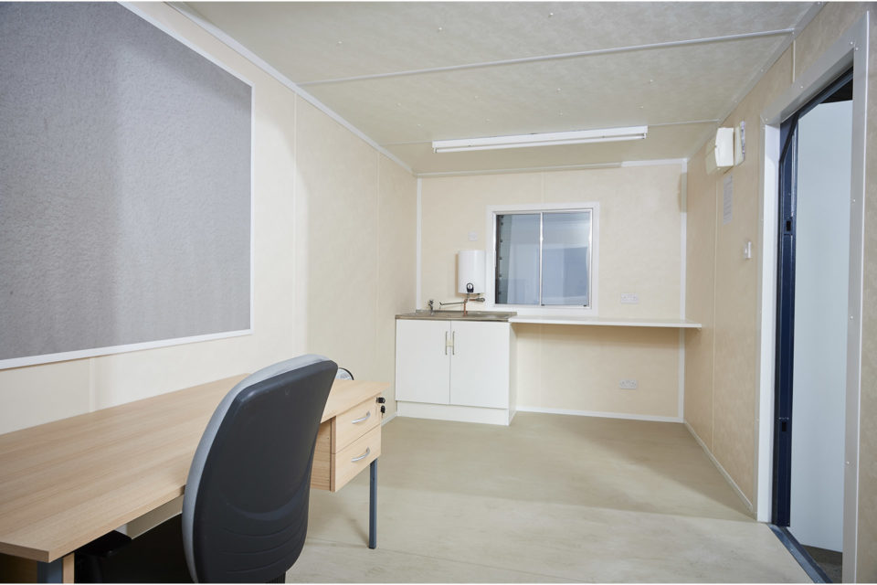 Inside view of combined office and kitchen cabin unit for hire