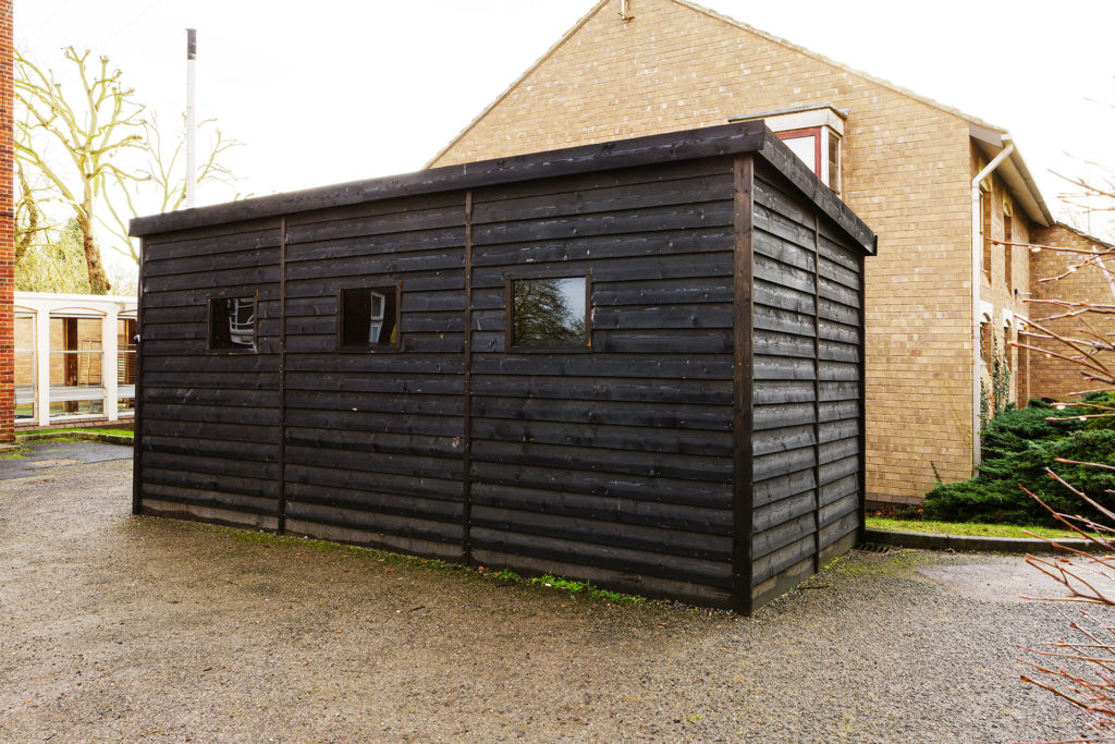 Exterior view of timber clad shipping container